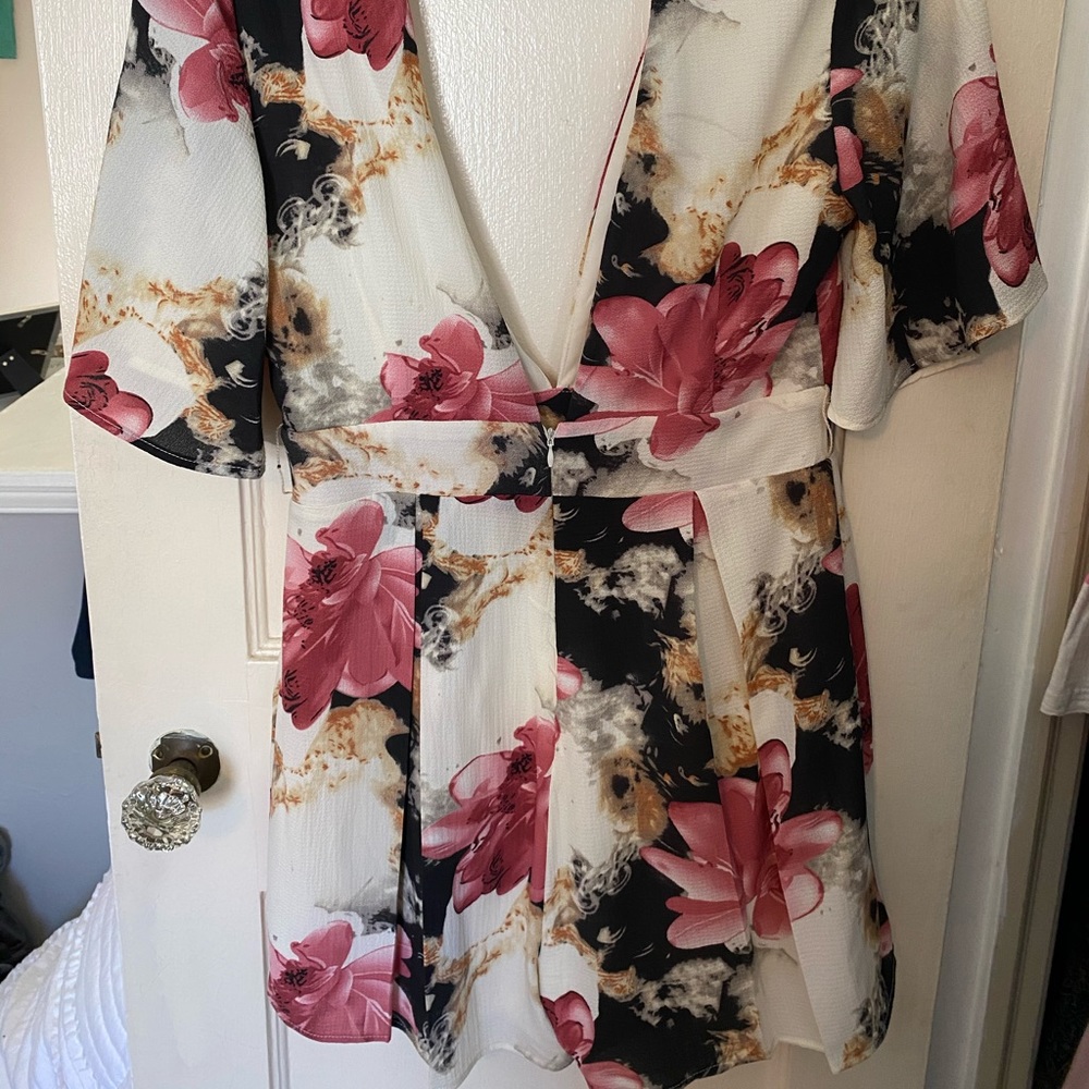 Deep neckline + Dressy Akira Floral Romper